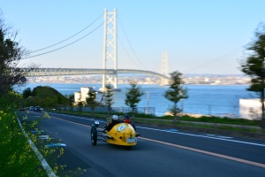 MORGAN 3 WHEELER driving on Awaji Sunset Line with view of Akashi Kaikyo Bridge